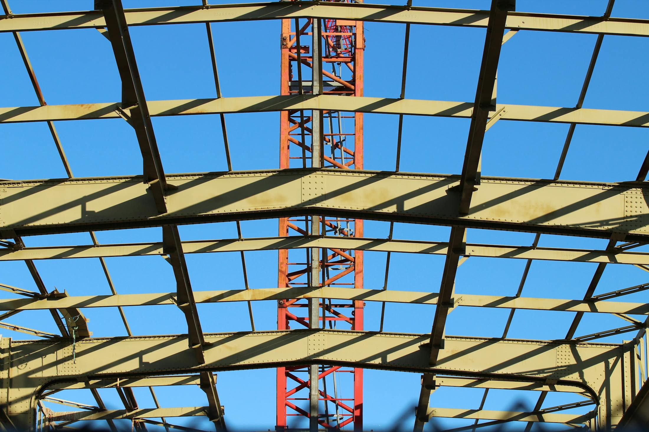 Fabricated structural steel beams and columns forming a commercial building frame