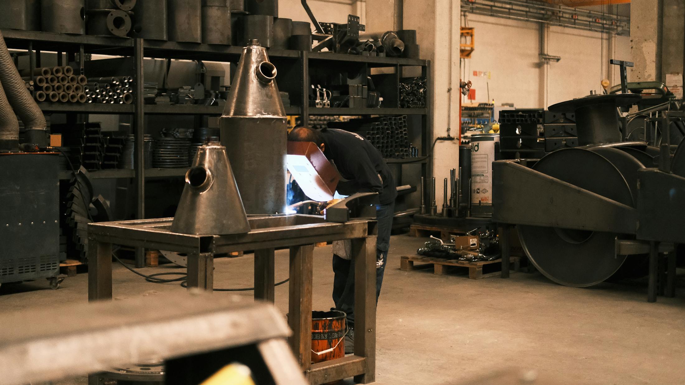 Welders fabricating structural steel in the workshop